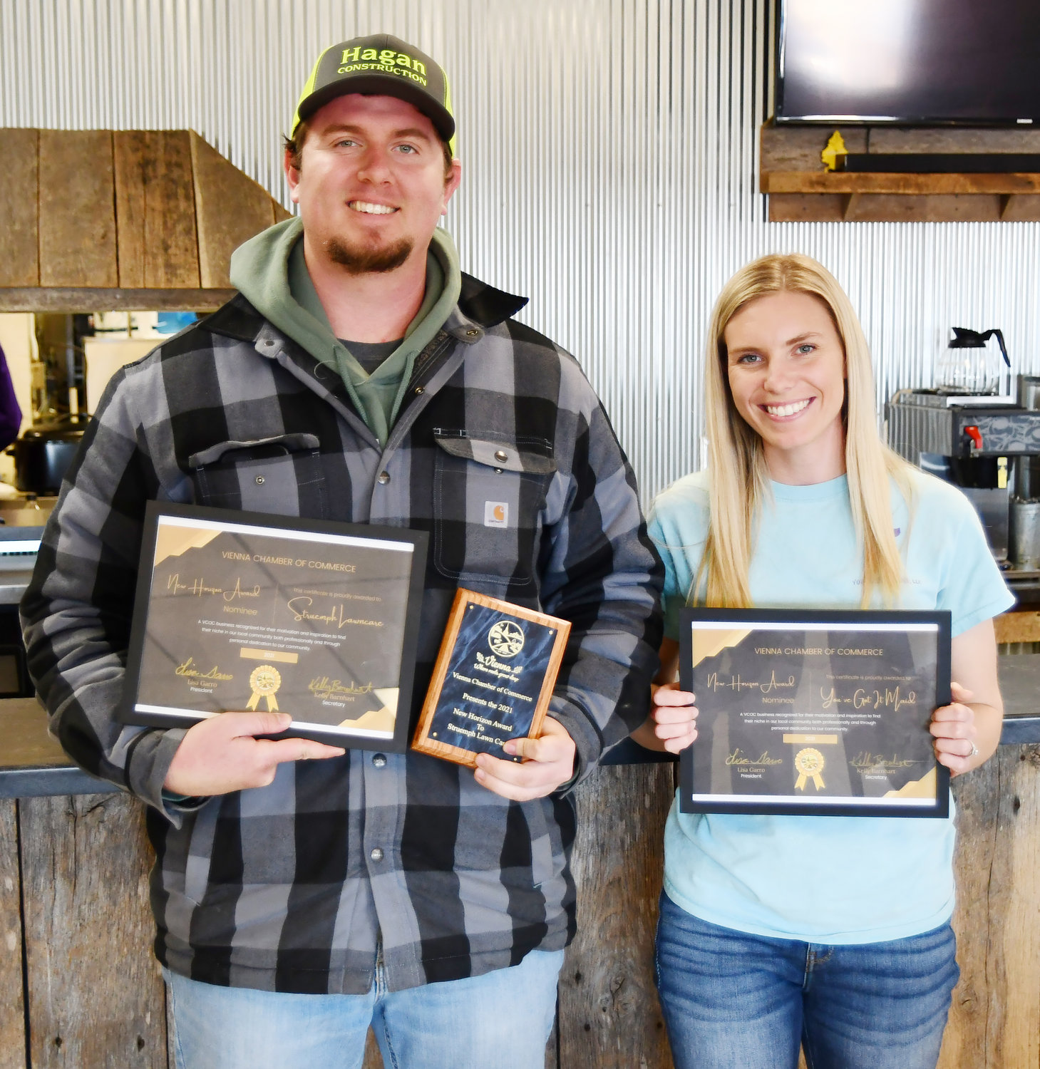 Dominic Struemph, owner of Struemph Lawn Care,  was the winner of the New Horizon Award. Pictured with him is one of the other nominees, Kalee Shumaker, owner of You’ve Got It Maid. Not pictured is Denine Bremer, owner of 63 Vintage Market and Antiques, which also was nominated for the award.